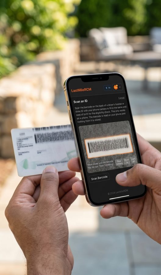 A community health worker outdoors holding a driver's license and scanning the barcode on the back with the LastMile RCM mobile app